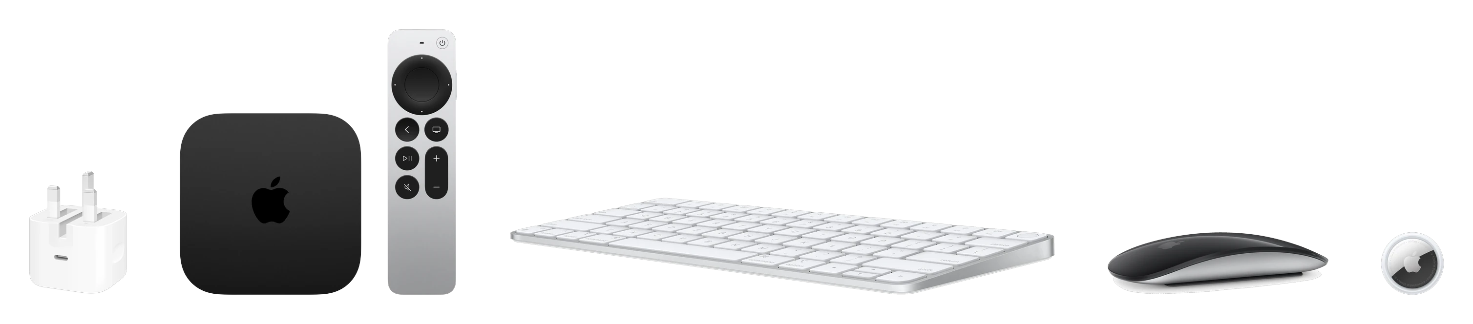 A row of Apple accessories: a 40W power adapter, Apple TV 4K with its Siri Remote, Magic Keyboard, Magic Mouse and an AirTag